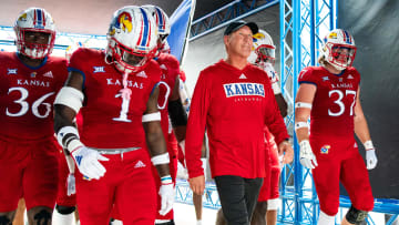 Sep 23, 2023; Lawrence, Kansas, USA; Kansas Jayhawks head coach Lance Leipold leads his team to the field prior to a game against the Brigham Young Cougars at David Booth Kansas Memorial Stadium. Mandatory Credit: Jay Biggerstaff-USA TODAY Sports