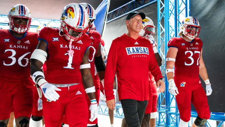 Sep 23, 2023; Lawrence, Kansas, USA; Kansas Jayhawks head coach Lance Leipold leads his team to the field prior to a game against the Brigham Young Cougars at David Booth Kansas Memorial Stadium. Mandatory Credit: Jay Biggerstaff-USA TODAY Sports