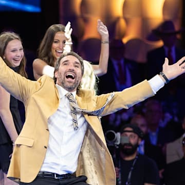 Aug 1, 2025; Canton, OH, USA; Jared Allen celebrates with his family after receiving his gold jacket at the 2025 Pro Football Hall of Fame Enshrinees’ Gold Jacket Dinner at Canton Memorial Civic Center.