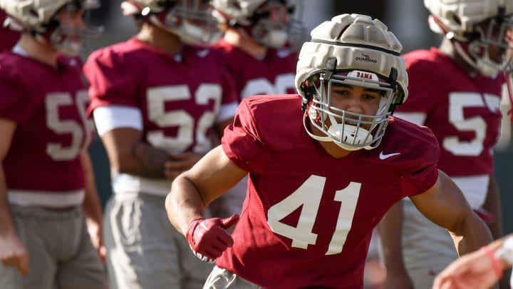 Mar 6, 2024; Tuscaloosa, Alabama, USA; Linebacker Justin Okoronkwo does a drill during practice for the Alabama Crimson Tide football team Wednesday.