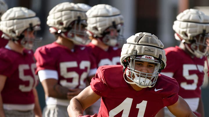 Mar 6, 2024; Tuscaloosa, Alabama, USA; Linebacker Justin Okoronkwo does a drill during practice for the Alabama Crimson Tide football team Wednesday.