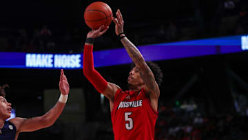 Feb 1, 2025; Atlanta, Georgia, USA; Louisville Cardinals guard Terrence Edwards Jr. (5) shoots against the Georgia Tech Yellow Jackets in the first half at McCamish Pavilion. 