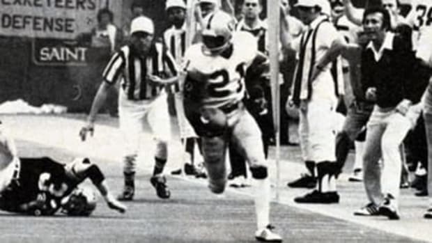 Oakland Raiders receiver Cliff Branch (21) breaks away for a long touchdown against the New Orleans Saints in a 1979 game  