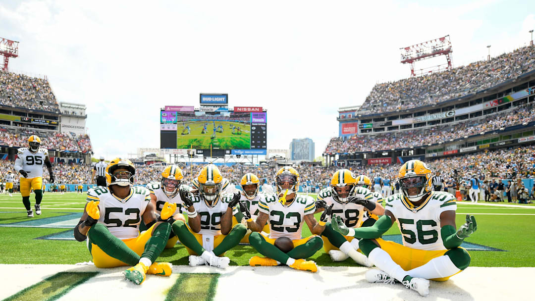Sep 22, 2024; Nashville, Tennessee, USA;  Green Bay Packers cornerback Jaire Alexander (23) celebrates with his teammates after scoring a touchdown on a interception against the Tennessee Titans during the first half at Nissan Stadium. Mandatory Credit: Steve Roberts-Imagn Images