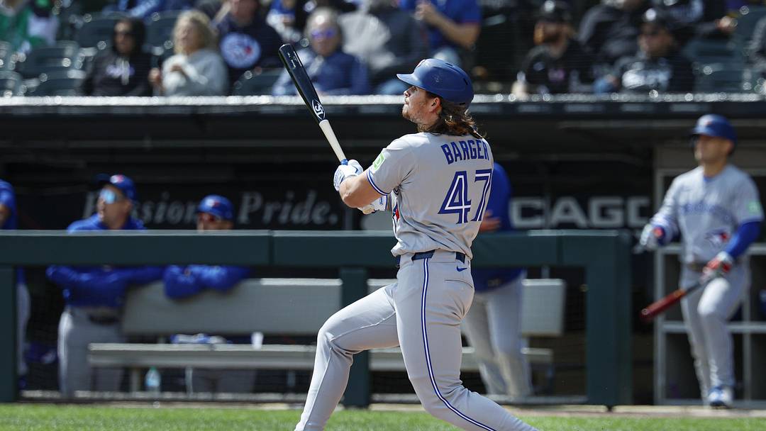 Apr 3, 2026; Chicago, Illinois, USA; Toronto Blue Jays right fielder Addison Barger (47) hits a double against the Chicago White Sox during the second inning at Rate Field. Mandatory Credit: Kamil Krzaczynski-Imagn Images
