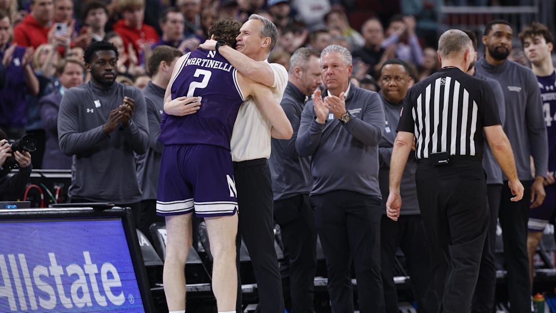 Mar 12, 2026; Chicago, IL, USA; Northwestern Wildcats head coach Chris Collins hugs forward Nick Martinelli (2) as he leaves the game against Purdue Boilermakers during the second half at United Center. Mandatory Credit: Kamil Krzaczynski-Imagn Images