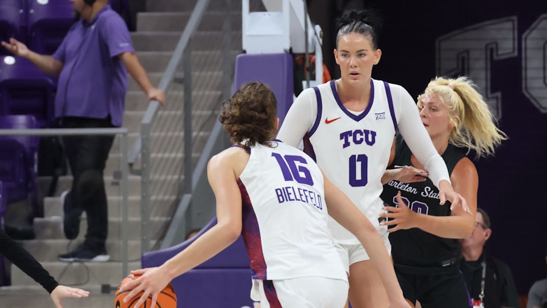 Clara Bielefield drives inside as Kennedy Basham sets the screen