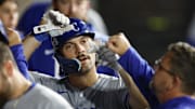 Kansas City Royals second baseman Adam Frazier (26) celebrates with teammates in the dugout after scoring against the Chicago White Sox during the fifth inning at Rate Field.