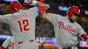 Sep 16, 2025; Los Angeles, California, USA;  Philadelphia Phillies catcher Rafael Marchan (13) celebrates with left fielder Kyle Schwarber (12) after hitting a 3-run home run in the ninth inning against the Los Angeles Dodgers at Dodger Stadium. Mandatory Credit: Jayne Kamin-Oncea-Imagn Images
