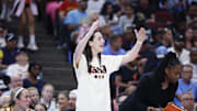 Jul 27, 2025; Chicago, Illinois, USA; Injured Indiana Fever guard Caitlin Clark (22) reacts during the first half of a basketball game against the Chicago Sky at United Center. Mandatory Credit: Kamil Krzaczynski-Imagn Images