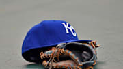 Apr 17, 2015; Kansas City, MO, USA; A general view of the hat and glove of Kansas City Royals first basemen Eric Hosmer the field prior to a game against the Oakland Athletics at Kauffman Stadium. Mandatory Credit: Peter G. Aiken-Imagn Images