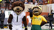 Nov 25, 2022; Austin, Texas, USA; Baylor Bears mascots Brusier (1) and Marigold during the second half against the Texas Longhorns at Darrell K Royal-Texas Memorial Stadium. Mandatory Credit: Scott Wachter-Imagn Images