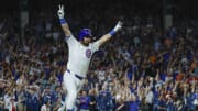 Chicago Cubs outfielder Mike Tauchman (40) celebrates his walk-off single against the St. Louis Cardinals during the ninth inning at Wrigley Field