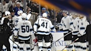 Fans and teammates salute Utah Hockey Club defenseman Robert Bortuzzo after a game vs. the St. Louis Blues