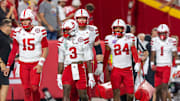 Dylan Raiola (15), Marques Buford Jr. (3), Henry Lutovsky (rear) and Derek Branch (24) were Nebraska's game captains vs Cincy
