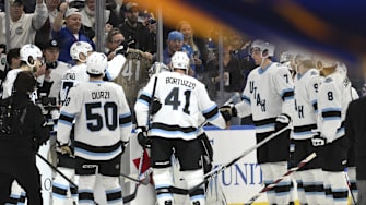 Fans and teammates salute Utah Hockey Club defenseman Robert Bortuzzo after a game vs. the St. Louis Blues