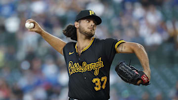 Sep 2, 2024; Chicago, Illinois, USA; Pittsburgh Pirates starting pitcher Jared Jones (37) delivers a pitch against the Chicago Cubs during the first inning at Wrigley Field. Mandatory Credit: Kamil Krzaczynski-USA TODAY Sports