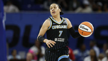 Aug 25, 2024; Chicago, Illinois, USA; Chicago Sky guard Chennedy Carter (7) brings the ball up court against the Las Vegas Aces during the first half at Wintrust Arena. Mandatory Credit: Kamil Krzaczynski-USA TODAY Sports