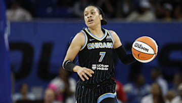 Aug 25, 2024; Chicago, Illinois, USA; Chicago Sky guard Chennedy Carter (7) brings the ball up court against the Las Vegas Aces during the first half at Wintrust Arena. Mandatory Credit: Kamil Krzaczynski-Imagn Images