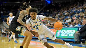 Nov 18, 2025; Los Angeles, California, USA;  UCLA Bruins guard Donovan Dent (2) is defended by Sacramento State Hornets guard Jahni Summers (4) during the second half at Pauley Pavilion presented by Wescom Financial. Mandatory Credit: Jayne Kamin-Oncea-Imagn Images