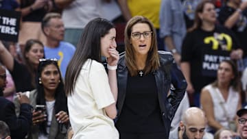 Jul 27, 2025; Chicago, Illinois, USA; Indiana Fever head coach Stephanie White (R) talks to injured guard Caitlin Clark (L) before a basketball game against the Chicago Sky at United Center. Mandatory Credit: Kamil Krzaczynski-Imagn Images