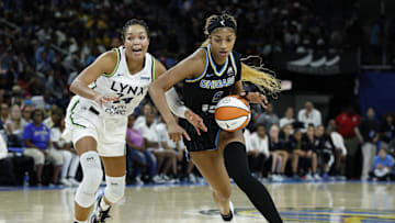 Jul 12, 2025; Chicago, Illinois, USA; Chicago Sky forward Angel Reese (5) drives to the basket against Minnesota Lynx forward Napheesa Collier (24) during the second half of a WNBA game at Wintrust Arena. Mandatory Credit: Kamil Krzaczynski-Imagn Images