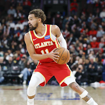 Oct 27, 2025; Chicago, Illinois, USA; Atlanta Hawks guard Trae Young (11) looks to pass the ball against the Chicago Bulls during the second half at United Center. Mandatory Credit: Kamil Krzaczynski-Imagn Images