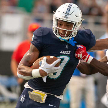 West Florida's John Jiles fends off West Georgia's Camyen Feagins as he goes in for the touch down during the Gulf South Conference opener against West Georgia at Pen Air Field at the University of West Florida Saturday, September 23, 2023.