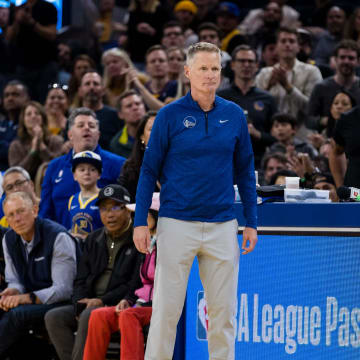 Oct 21, 2022; San Francisco, California, USA;  Golden State Warriors head coach Steve Kerr and guard Klay Thompson (11) watch during the second half of the game against the Denver Nuggets at Chase Center. Mandatory Credit: John Hefti-USA TODAY Sports