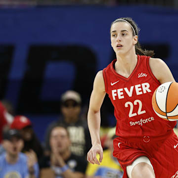 Aug 30, 2024; Chicago, Illinois, USA; Indiana Fever guard Caitlin Clark (22) brings the ball up court against the Chicago Sky during the first half at Wintrust Arena. Mandatory Credit: Kamil Krzaczynski-Imagn Images