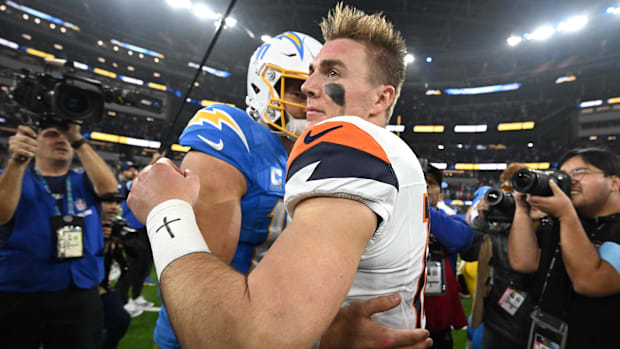 Dec 19, 2024; Inglewood, California, USA;  Los Angeles Chargers quarterback Justin Herbert (10) and Denver Broncos quarterbac