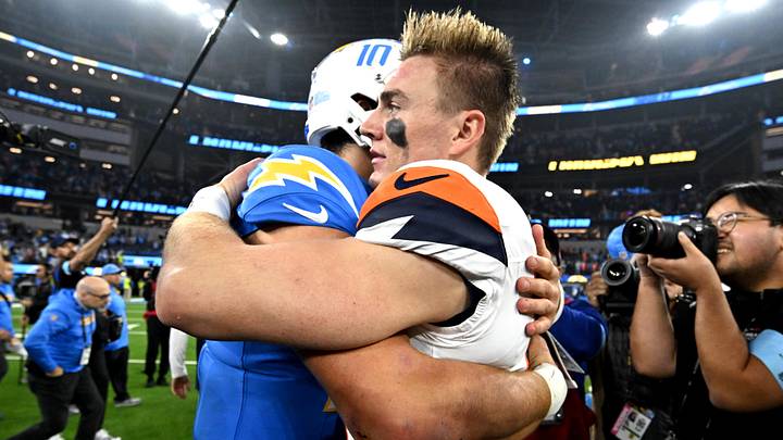 Dec 19, 2024; Inglewood, California, USA;  Los Angeles Chargers quarterback Justin Herbert (10) and Denver Broncos quarterback Bo Nix (10) embrace following the game at SoFi Stadium. Mandatory Credit: Jayne Kamin-Oncea-Imagn Images
