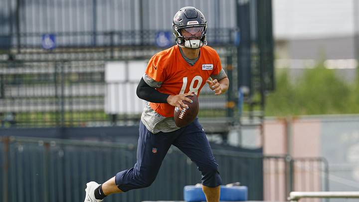 Jul 24, 2025; Lake Forest, IL, USA; Chicago Bears quarterback Caleb Williams (18) runs with the ball during training camp at Halas Hall. Mandatory Credit: Kamil Krzaczynski-Imagn Images