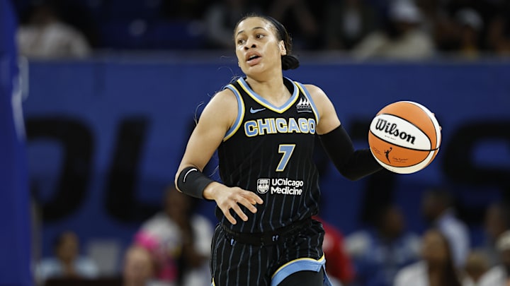 Aug 25, 2024; Chicago, Illinois, USA; Chicago Sky guard Chennedy Carter (7) brings the ball up court against the Las Vegas Aces during the first half at Wintrust Arena. Mandatory Credit: Kamil Krzaczynski-USA TODAY Sports