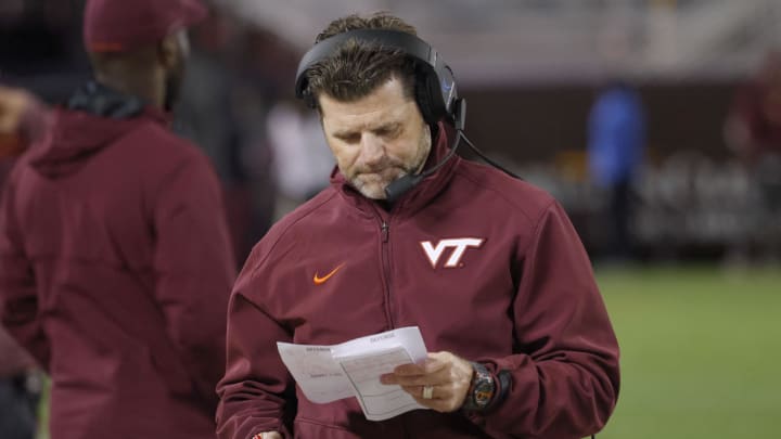 Sep 22, 2022; Blacksburg, Virginia, USA; Virginia Tech Hokies head coach Brent Pry checks his charts during the second half against the West Virginia Mountaineers at Lane Stadium. Mandatory Credit: Reinhold Matay-USA TODAY Sports