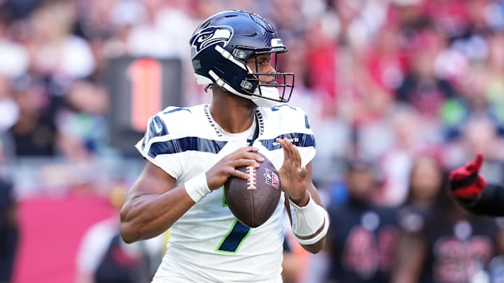 Dec 8, 2024; Glendale, Arizona, USA; Seattle Seahawks quarterback Geno Smith (7) passes against the Arizona Cardinals during the first half at State Farm Stadium. Mandatory Credit: Joe Camporeale-Imagn Images