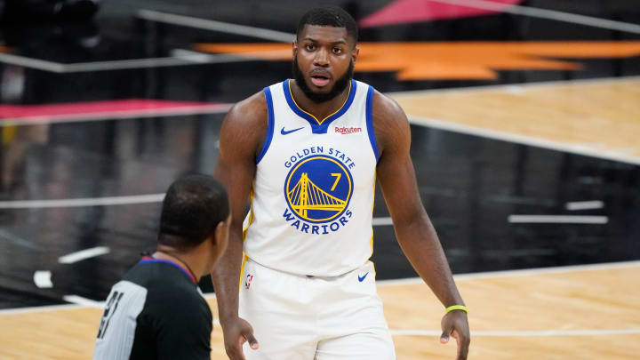 Feb 9, 2021; San Antonio, Texas, USA; Golden State Warriors forward Eric Paschall (7) argues a call with official Mitchell Ervin (27) in the first quarter against the San Antonio Spurs at AT&T Center. Mandatory Credit: Scott Wachter-USA TODAY Sports