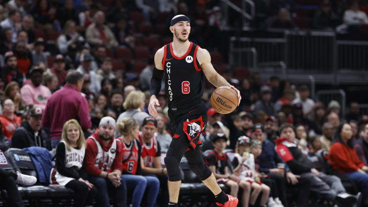 Apr 1, 2024; Chicago, Illinois, USA; Chicago Bulls guard Alex Caruso (6) drives to the basket against the Atlanta Hawks during the first half at United Center. Mandatory Credit: Kamil Krzaczynski-USA TODAY Sports