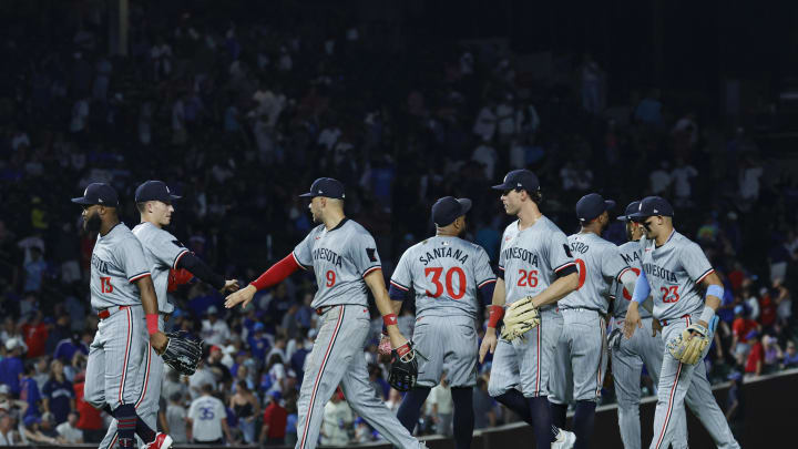 Minnesota Twins players celebrate after defeating the Chicago Cubs in a baseball game at Wrigley Field in Chicago on Aug. 5, 2024.