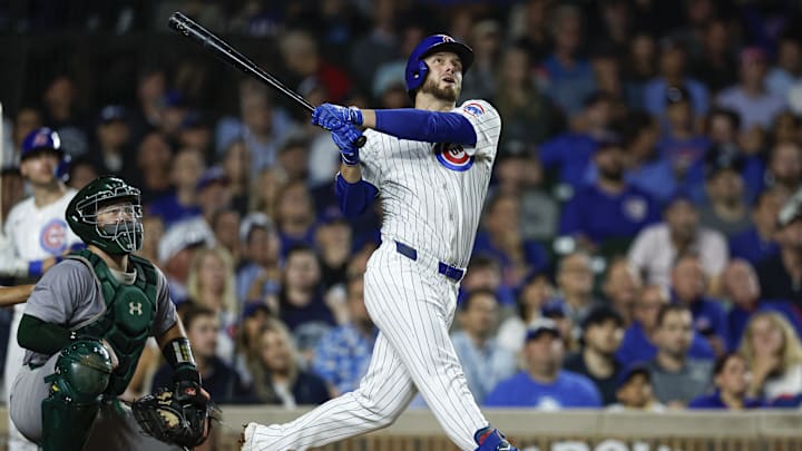 Sep 17, 2024; Chicago, Illinois, USA; Chicago Cubs first baseman Michael Busch (29) hits an RBI-single against the Oakland Athletics during the third inning at Wrigley Field. Sep 17, 2024; Chicago, Illinois, USA; Chicago Cubs first baseman Michael Busch (29) hits an RBI-single against the Oakland Athletics during the third inning at Wrigley Field.