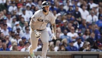 Sep 6, 2024; Chicago, Illinois, USA; New York Yankees outfielder Alex Verdugo (24) runs after hitting a single against the Chicago Cubs during the ninth inning at Wrigley Field. Mandatory Credit: Kamil Krzaczynski-Imagn Images