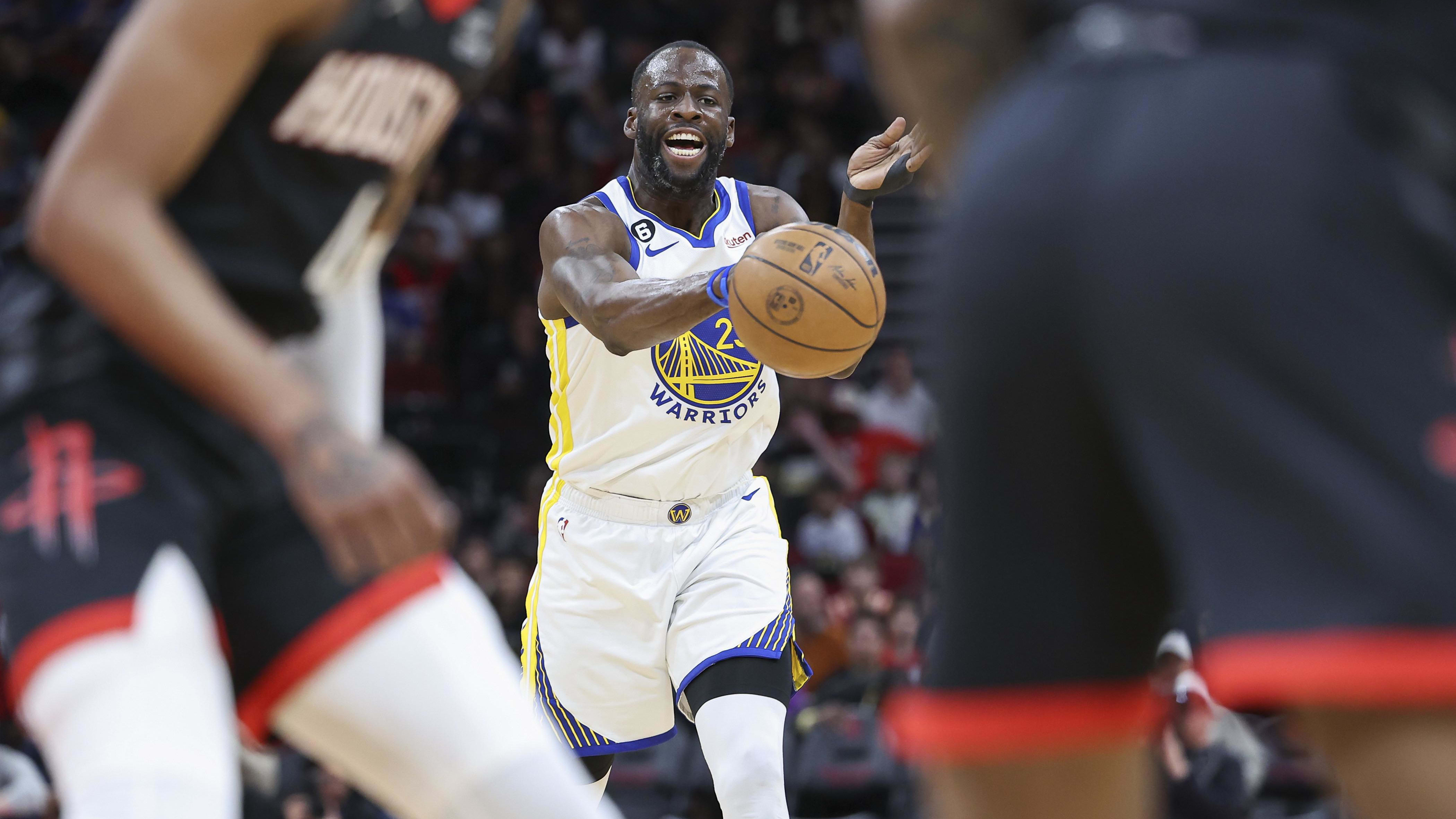 Mar 20, 2023; Houston, Texas, USA; Golden State Warriors forward Draymond Green (23) passes the ball against the Houston Rockets.