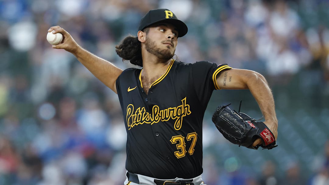 Sep 2, 2024; Chicago, Illinois, USA; Pittsburgh Pirates starting pitcher Jared Jones (37) delivers a pitch against the Chicago Cubs during the first inning at Wrigley Field. Mandatory Credit: Kamil Krzaczynski-Imagn Images