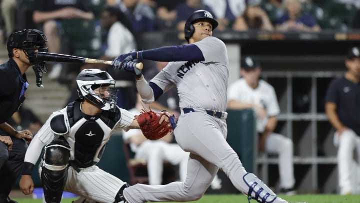 Aug 13, 2024; Chicago, Illinois, USA; New York Yankees outfielder Juan Soto (22) hits a solo home run against the Chicago White Sox during the seventh inning at Guaranteed Rate Field. Mandatory Credit: Kamil Krzaczynski-USA TODAY Sports