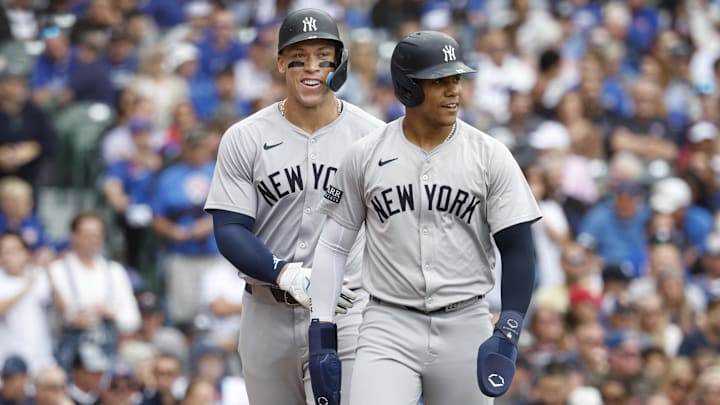 Sep 6, 2024; Chicago, Illinois, USA; New York Yankees outfielder Aaron Judge (99) and New York Yankees outfielder Juan Soto (22) celebrate after scoring agianst the Chicago Cubs during the third inning at Wrigley Field. Mandatory Credit: Kamil Krzaczynski-Imagn Images