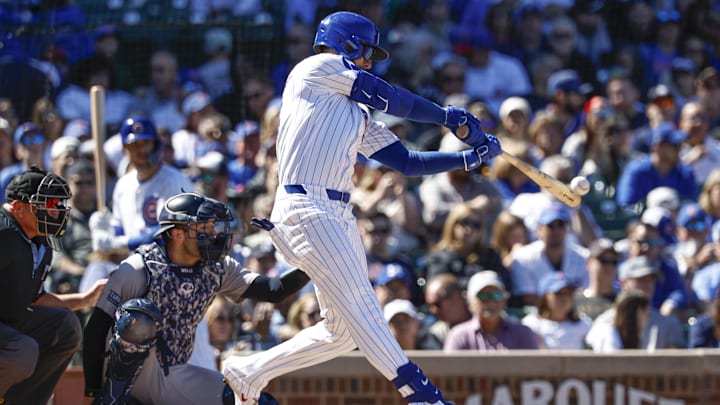 Sep 7, 2024; Chicago, Illinois, USA; Chicago Cubs outfielder Cody Bellinger (24) singles against the New York Yankees during the fourth inning at Wrigley Field.