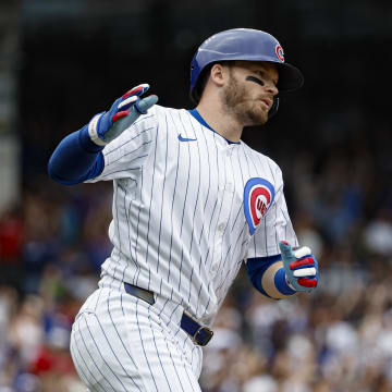 Jul 4, 2024; Chicago, Illinois, USA; Chicago Cubs outfielder Ian Happ rounds the bases.