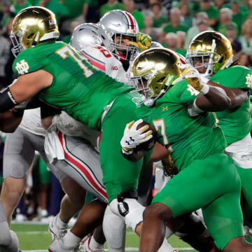 Sep 23, 2023; South Bend, Indiana, USA; Notre Dame Fighting Irish running back Audric Estime (7) carries the ball against Ohio State Buckeyes during the second quarter of their game at Notre Dame Stadium.