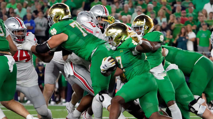 Sep 23, 2023; South Bend, Indiana, USA; Notre Dame Fighting Irish running back Audric Estime (7) carries the ball against Ohio State Buckeyes during the second quarter of their game at Notre Dame Stadium.