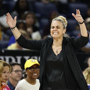 Aug 25, 2024; Chicago, Illinois, USA; Las Vegas Aces head coach Becky Hammon (L) argues a call against her team with official Tim Greene (R) during the first half of a basketball game against the Chicago Sky at Wintrust Arena. Mandatory Credit: Kamil Krzaczynski-Imagn Images